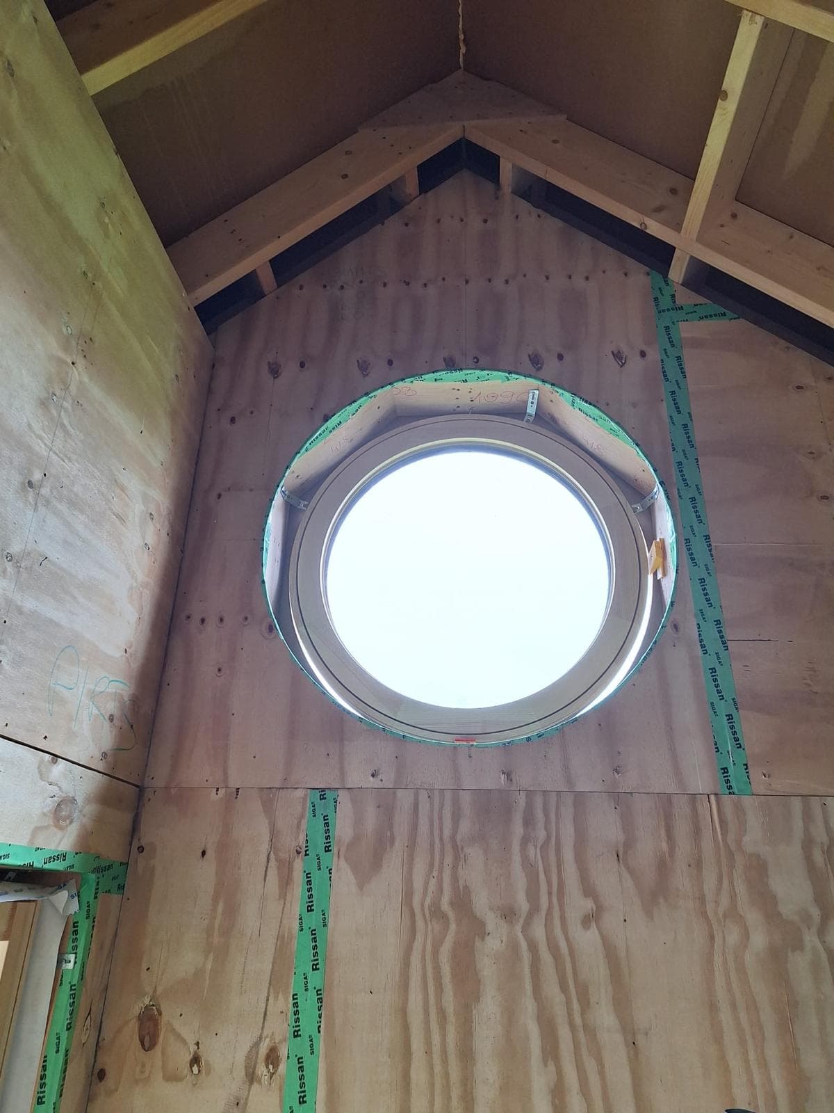 Interior view of O360 round window installation with airtight membrane