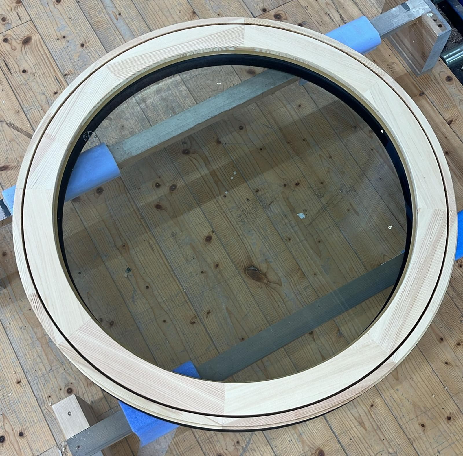 O360 round window unit showing timber frame and triple glazing